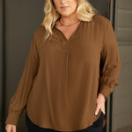 This is the Ellis Shirt in Nuthatch — an effortless piece with an oversized silhouette that’s made to move with you. Designed to be worn untucked or styled with a front or back tuck, it transitions seamlessly from relaxed to refined.