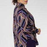 Showcasing a bold geometric striped print, this eye-catching piece offers a fresh take on classic shirting with its flowing silhouette and modern detailing. Crafted for comfort and movement.