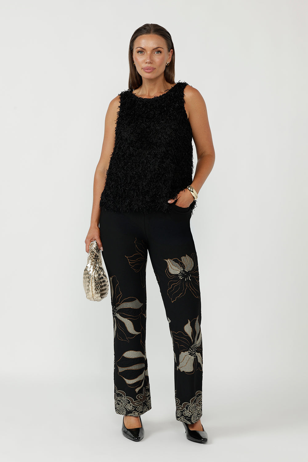 Gilded Noir Pant crafted from luxe winter-weight jacquard knit with soft stretch, featuring a textured black base with elegant toffee and cream print detailing and a flattering bootcut silhouette.