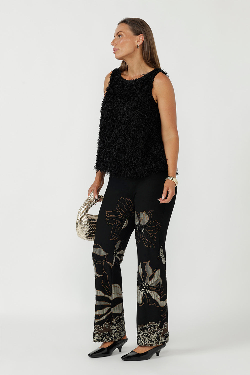 Women's Gilded Noir Pant in a premium stretch jacquard knit, designed with a comfortable pull-on waist, angled front pockets and a sophisticated full-length bootcut leg.