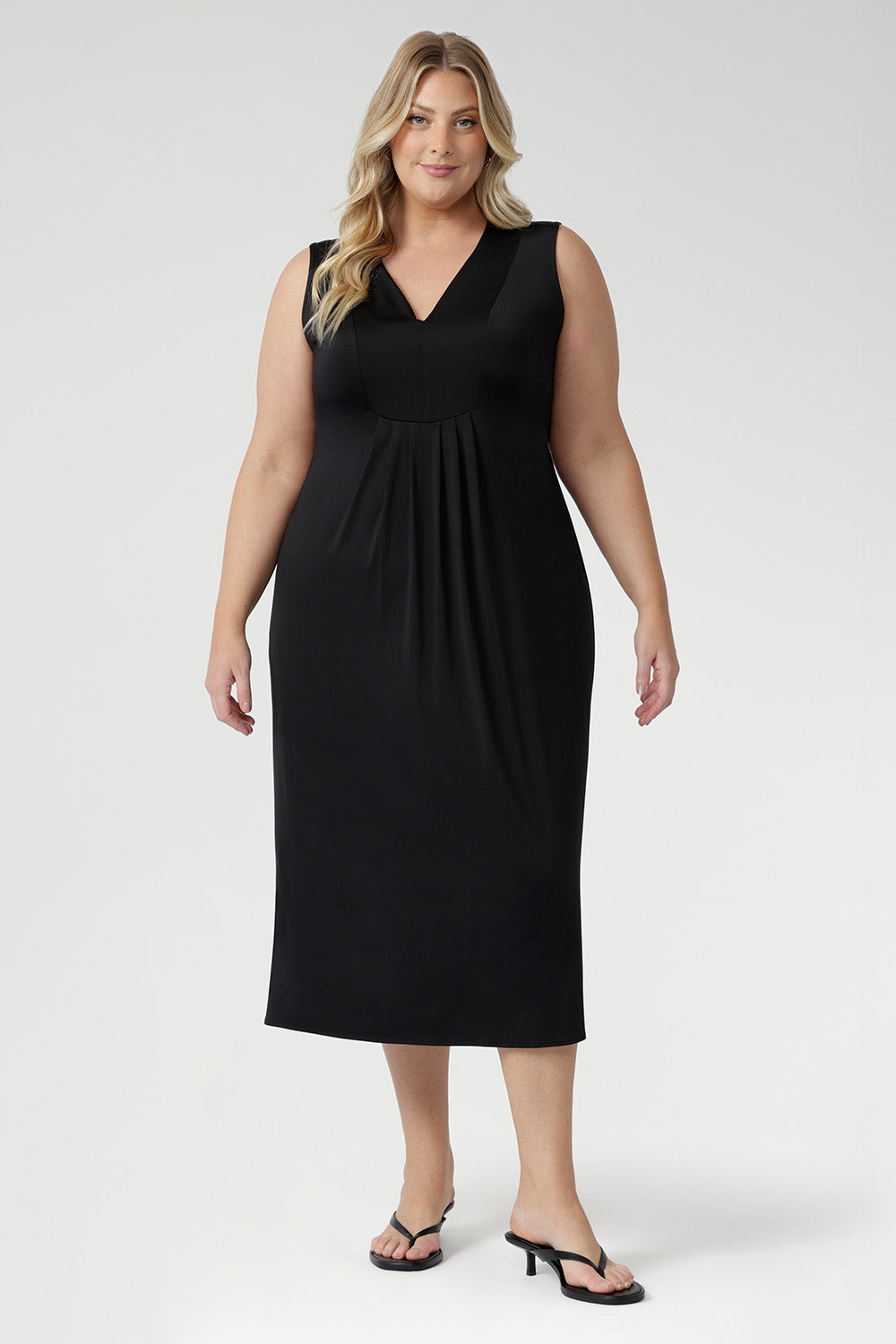 Australian-made Fernanda Dress in Black featuring soft stretch fabric, side splits, and cool-touch comfort for effortless summer style.