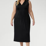 Australian-made Fernanda Dress in Black featuring soft stretch fabric, side splits, and cool-touch comfort for effortless summer style.