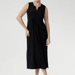 Fernanda Dress in Black — sleeveless slinky midi sundress with front pleats and waist ties, perfect for summer getaways and resort wear.