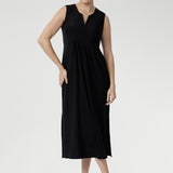 Fernanda Dress in Black — sleeveless slinky midi sundress with front pleats and waist ties, perfect for summer getaways and resort wear.