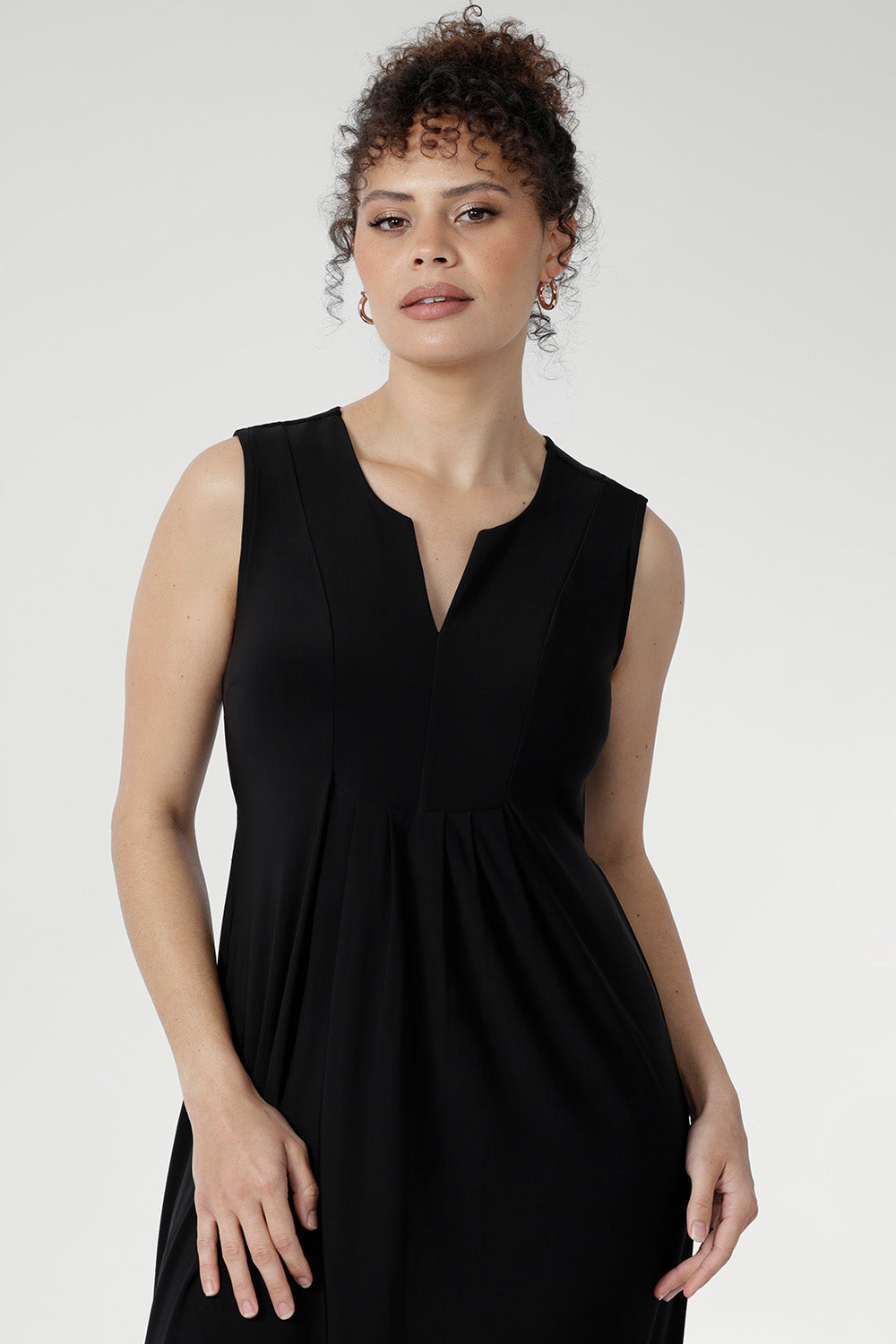 Cool-touch slinky Fernanda Dress in Black, a timeless midi sundress with front pleats, side splits, and effortless summer appeal.
