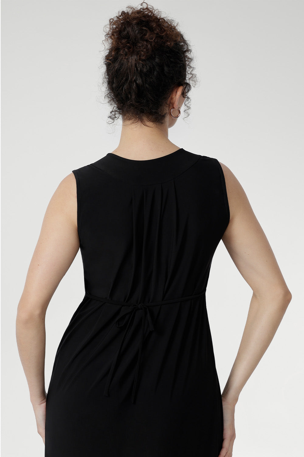 Sleeveless slinky midi sundress with front pleats and waist ties, perfect for summer getaways and resort wear. Australian-made Fernanda Dress in Black featuring soft stretch fabric, side splits, and cool-touch comfort for effortless summer style.