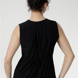 Sleeveless slinky midi sundress with front pleats and waist ties, perfect for summer getaways and resort wear. Australian-made Fernanda Dress in Black featuring soft stretch fabric, side splits, and cool-touch comfort for effortless summer style.