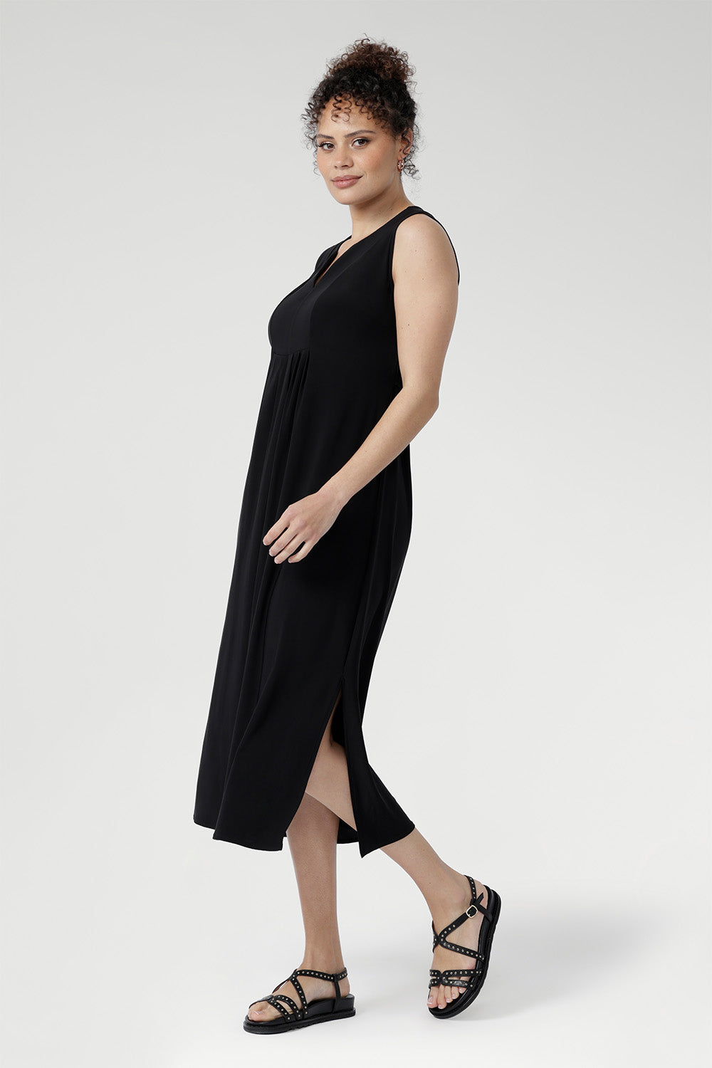 Summer-ready Fernanda Dress in Black with sleek sleeveless design, flattering front panels, and lightweight slinky fabric.