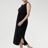 Summer-ready Fernanda Dress in Black with sleek sleeveless design, flattering front panels, and lightweight slinky fabric.