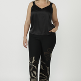 Full-length Gilded Noir Pant crafted from premium winter-weight jacquard knit, featuring angled front pockets, a streamlined pull-on fit and elegant toffee and cream detailing.