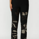 Elegant Gilded Noir pull-on pant crafted from winter-weight stretch jacquard knit with a mid-rise fit, angled pockets and a subtle bootcut flare for timeless style.