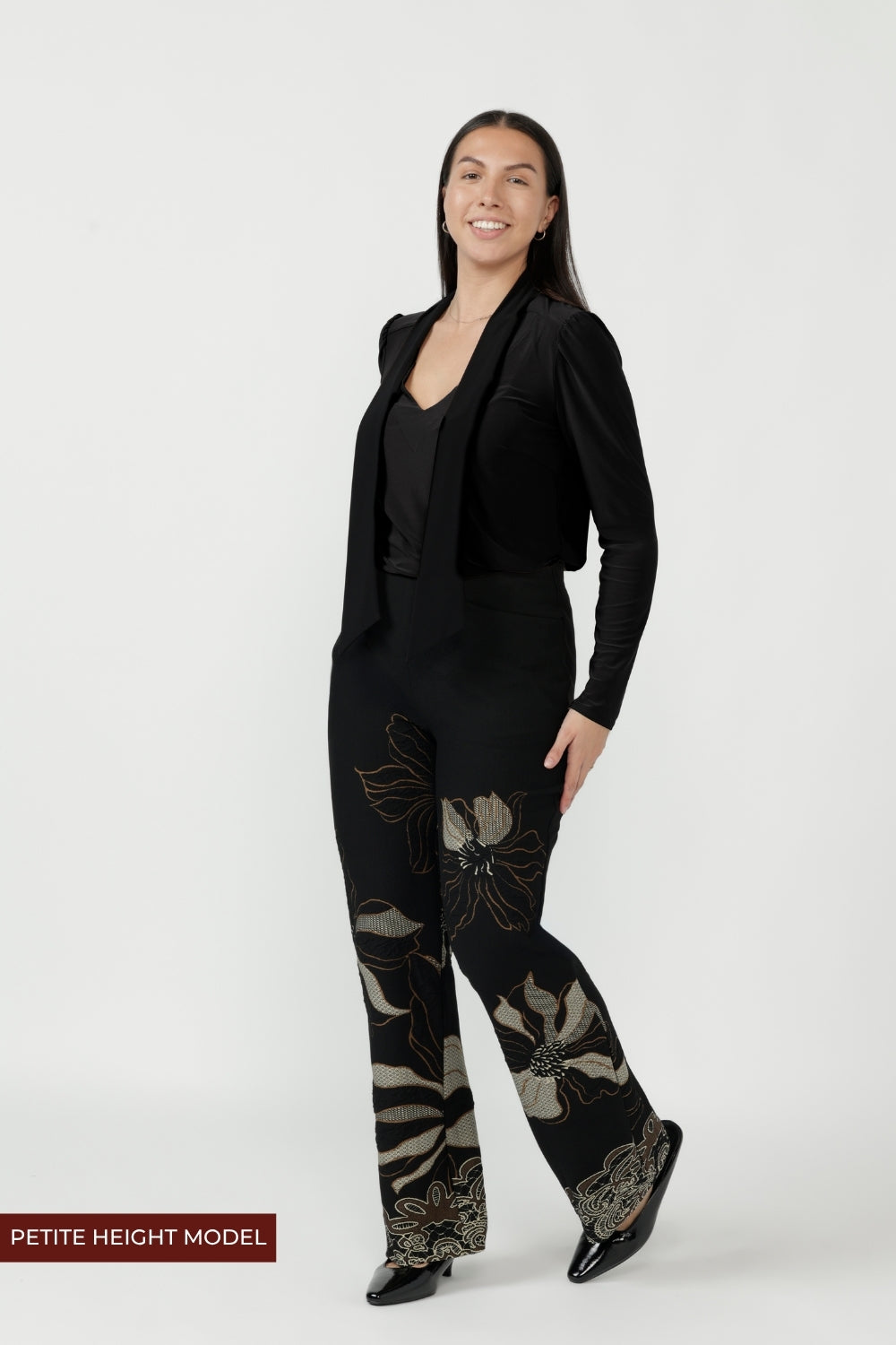 Elegant Gilded Noir pull-on pant crafted from winter-weight stretch jacquard knit with a mid-rise fit, angled pockets and a subtle bootcut flare for timeless style.