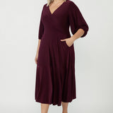 Women's Helena Dress in soft stretch jersey with a flattering V-neck wrap front, statement lantern sleeves and graceful maxi-length movement.