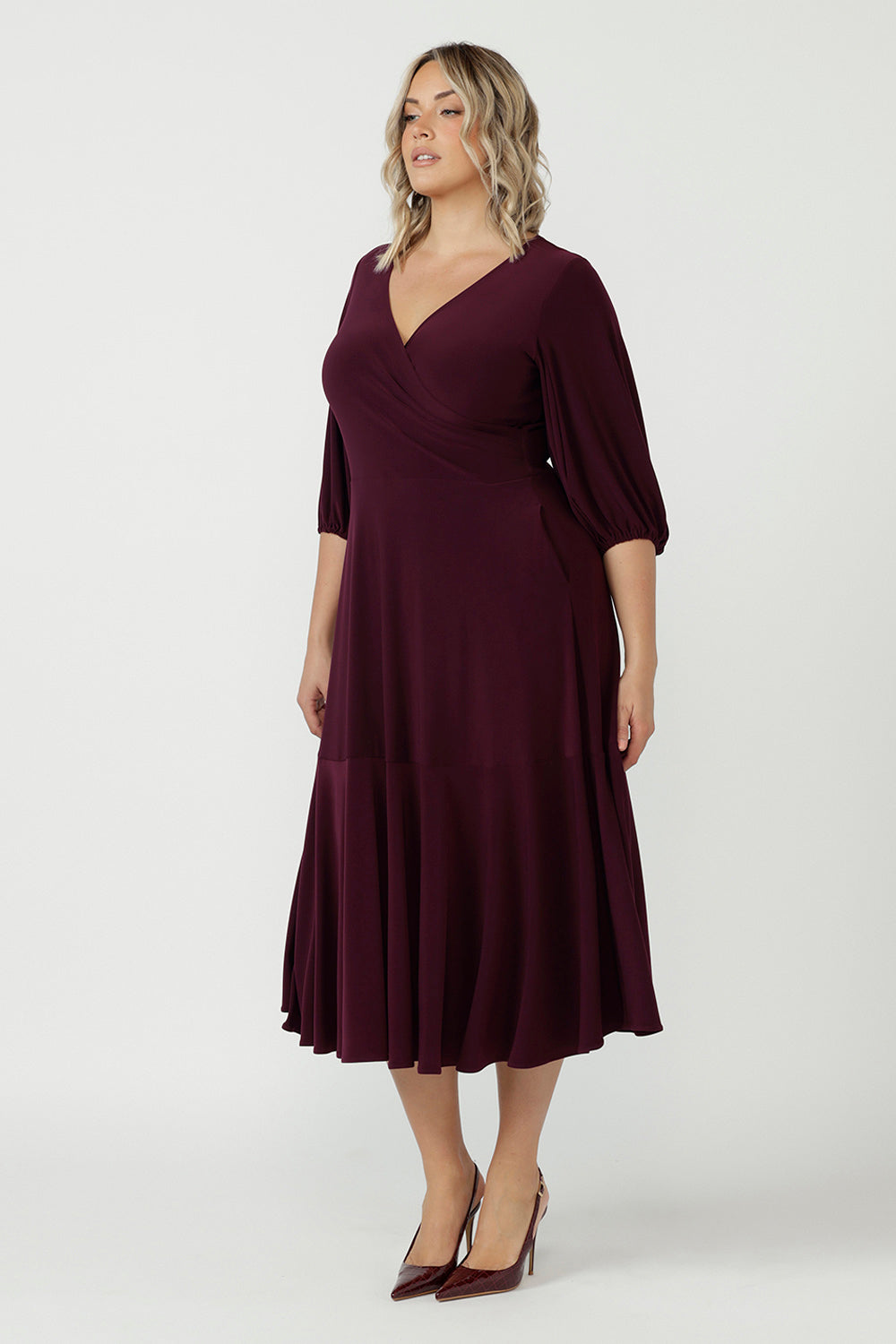 Australian-made Helena Dress designed with a sophisticated wrap-style bodice, flowing ruffle hem and comfortable stretch jersey fabrication for effortless occasion dressing.