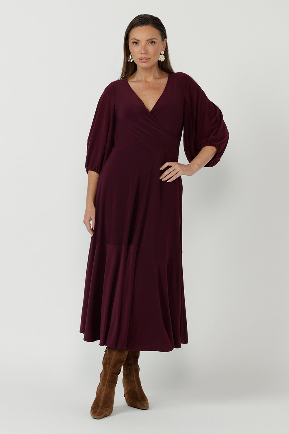 Helena Dress crafted from premium dry-touch stretch jersey, featuring a flowing maxi silhouette, fixed wrap bodice and cascading ruffle hem for timeless elegance.