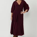 Helena Dress crafted from premium dry-touch stretch jersey, featuring a flowing maxi silhouette, fixed wrap bodice and cascading ruffle hem for timeless elegance.