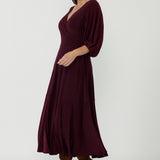 Luxe Helena Maxi Dress crafted from dry-touch stretch jersey with a flattering wrap neckline, lantern sleeves and elegant movement for special occasions and events.
