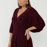 Elegant Helena Maxi Dress crafted from luxe dry-touch jersey, featuring voluminous lantern sleeves, a flattering V-neckline and practical side pockets.