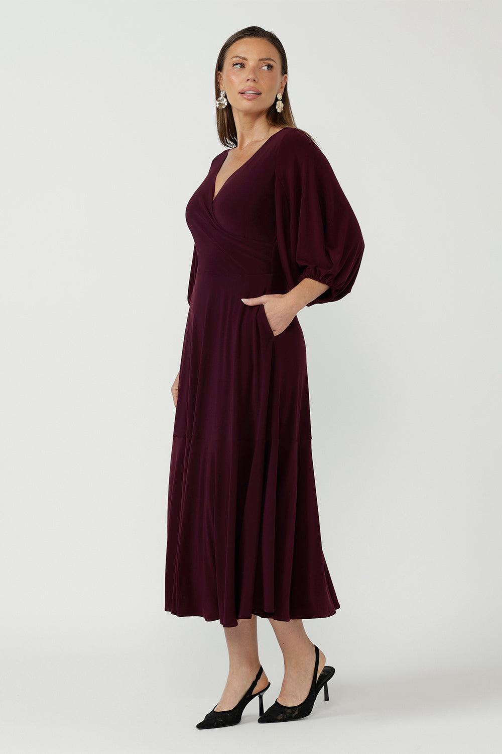 Sophisticated Helena Dress showcasing a fixed wrap bodice, flowing full-length skirt and soft stretch jersey fabrication for comfort and effortless glamour.