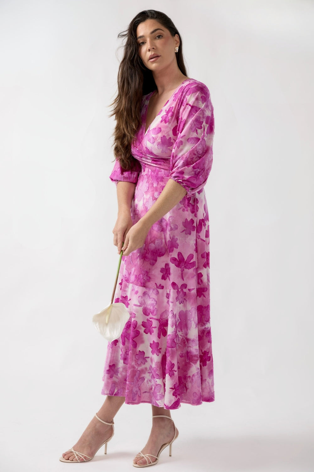 Women’s Helena Dress in surface-textured burnout fabric with a fixed wrap front, statement high-low lantern sleeves and an elegant flowing skirt with side pockets.