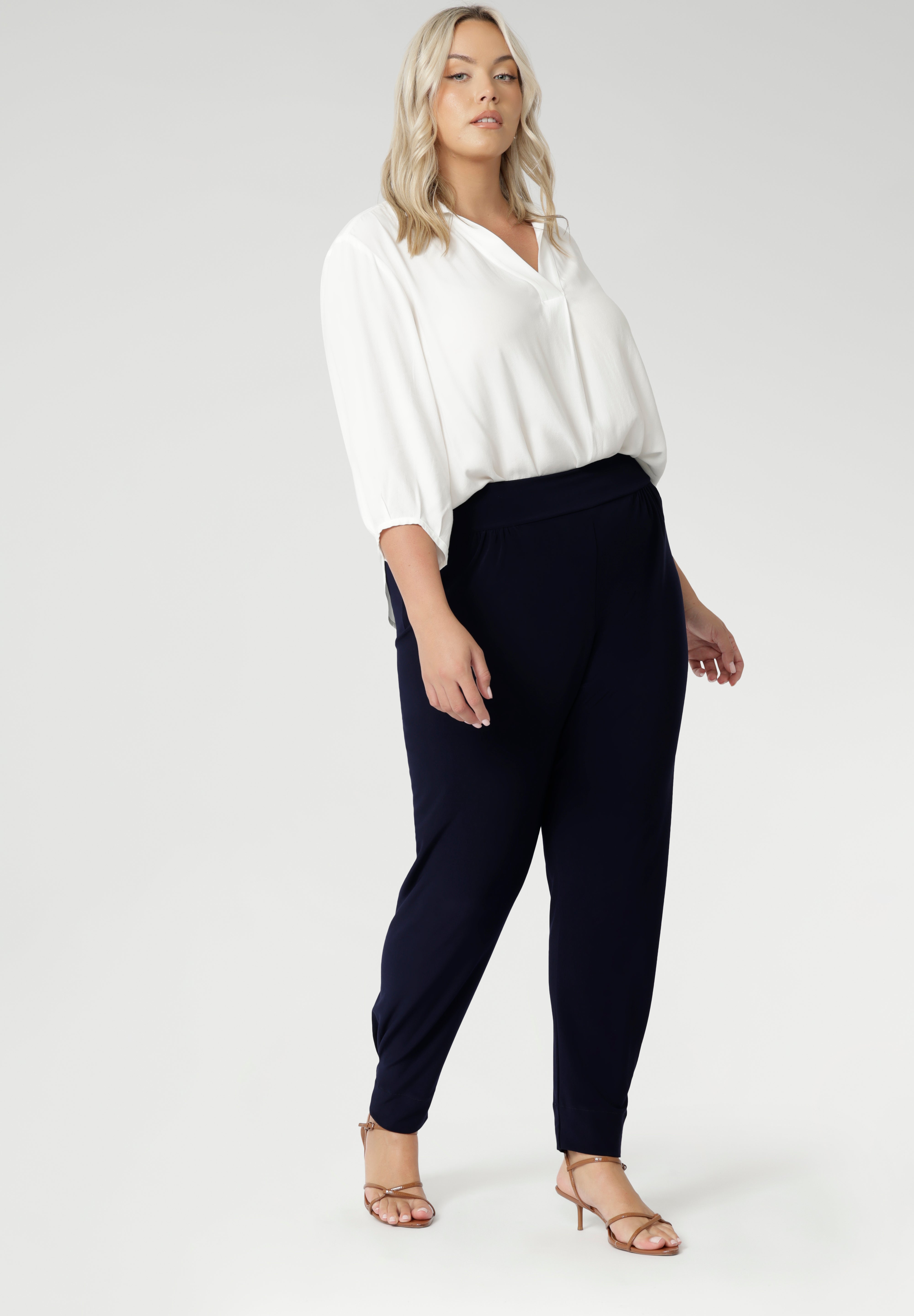 These chic 7/8 length pants feature single inside seam legs, a tapered fit, and ankle cuffs with a tuck detail, offering a sleek, modern silhouette. The Indi is the ultimate travel pant, so comfortable that you’ll want more than one pair. Perfectly versatile, it pairs effortlessly with our blazers for a seamless transition from weekend to work. Available in two different heights, designed for both plus-size and petite women.
