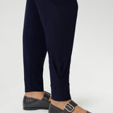 These stylish 7/8 length pants feature single inside seam legs, a tapered leg fit, and ankle cuffs with a tuck detail for a sleek, modern look.