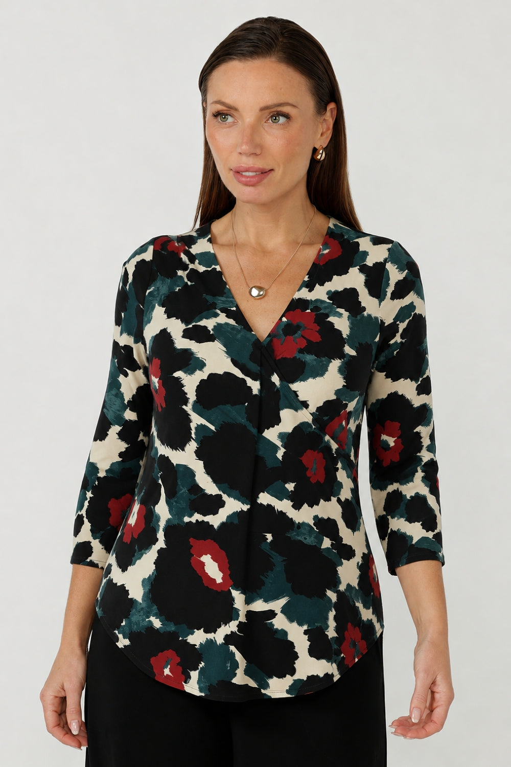 Modern women’s Jaime Top with a refined V-neckline, 3/4 sleeves and curved shirttail hem, designed in comfortable stretch jersey for polished everyday dressing.