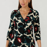 Modern women’s Jaime Top with a refined V-neckline, 3/4 sleeves and curved shirttail hem, designed in comfortable stretch jersey for polished everyday dressing.