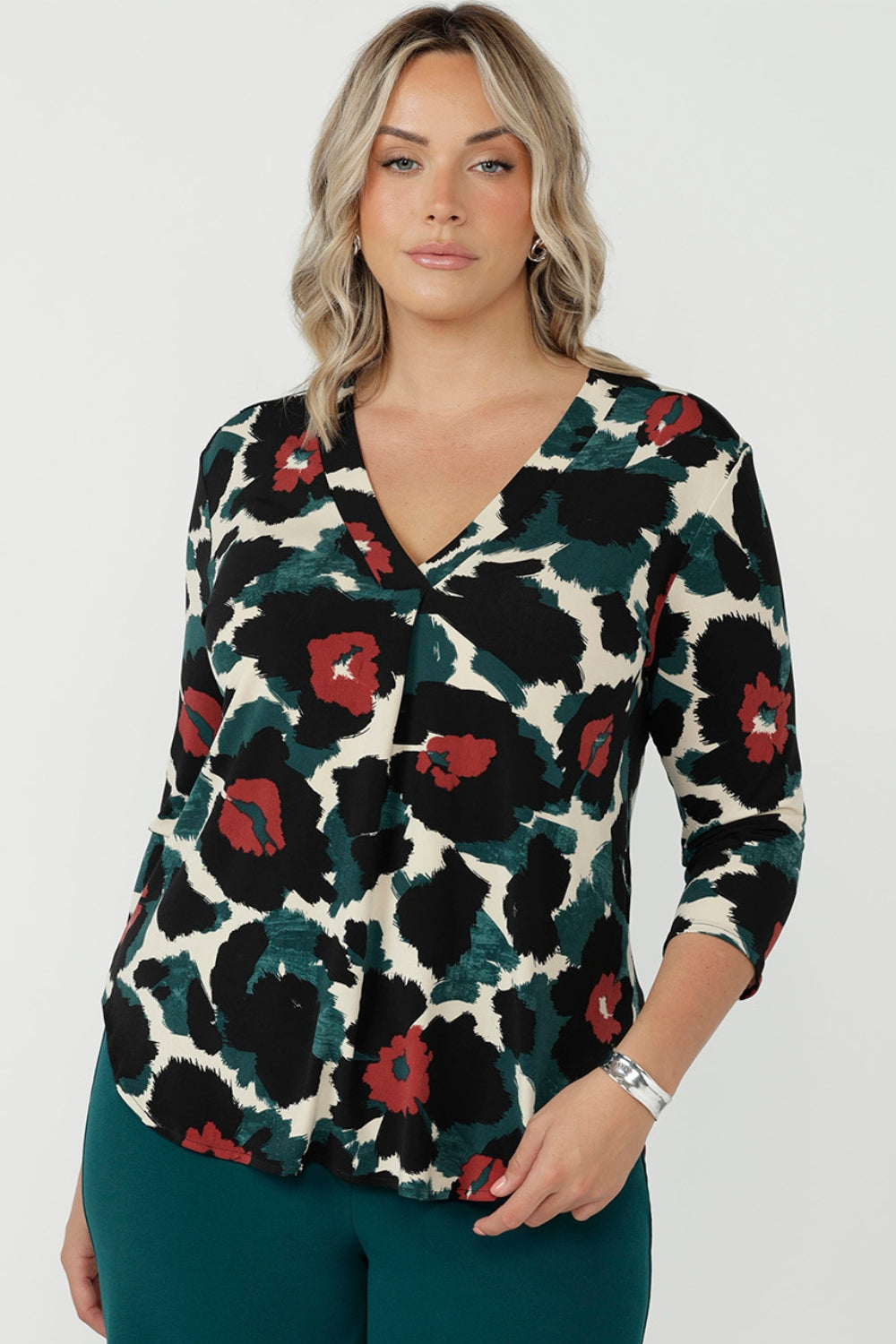 Women’s Jaime Top in soft stretch jersey with a flattering V-neck, relaxed tailored silhouette and curved shirttail hem for effortless work-to-weekend style.