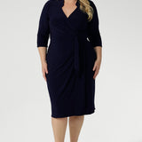 Designed with signature dry-touch stretch jersey fabric, the Jett Dress is a wrap dress, tailored for a corporate or event setting and featuring a modern angular collar. Available in Size 8-24 and Proudly Made in Australia.