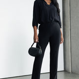 These classic black straight-leg pants are a timeless wardrobe essential, offering both style and comfort for a range of occasions. Made from soft-touch black jersey fabric, they provide a smooth, luxurious feel against the skin while offering breathability and flexibility for all-day wear.