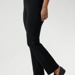 The straight-leg cut is both flattering and versatile, creating a clean, tailored silhouette that works for both casual and elevated looks. Size 12 model pairs black pants with white top & silver sneakers for a casual look.