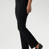 The straight-leg cut is both flattering and versatile, creating a clean, tailored silhouette that works for both casual and elevated looks. Size 12 model pairs black pants with white top & silver sneakers for a casual look.