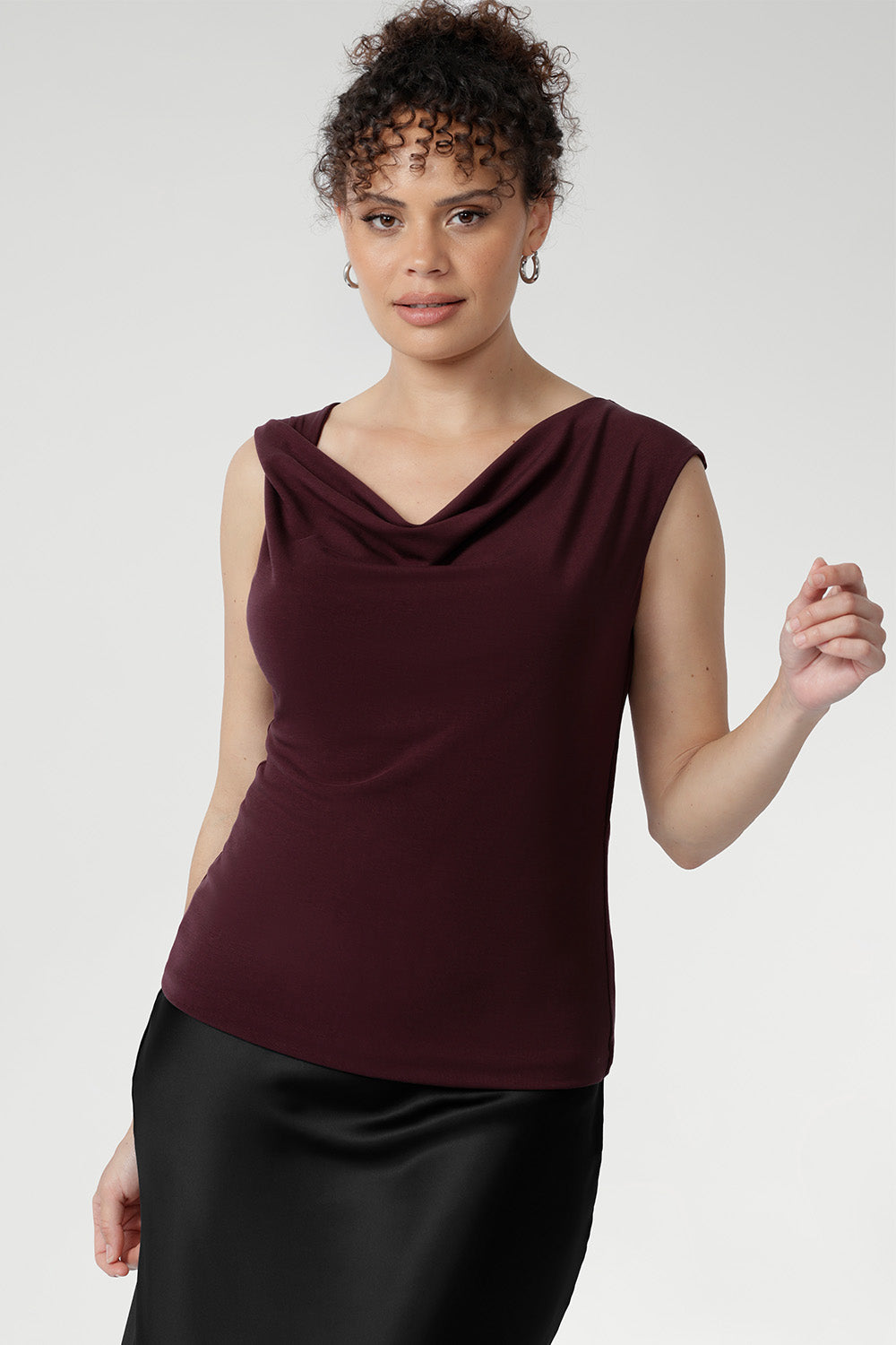 Crafted from a luxurious heavy-weight Lyocell knit fabric that feels silky to the touch and offers a rich, elegant appearance, the Jordan Top in Wine is designed for versatile, stylish wear. This reversible piece allows you to switch effortlessly between two distinct looks.