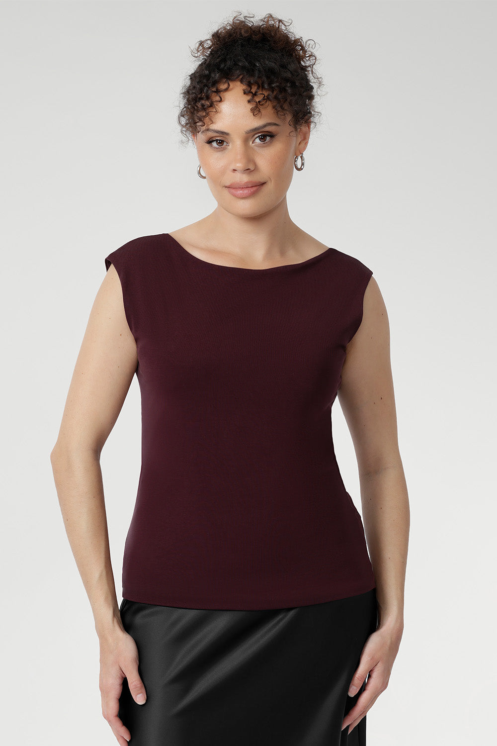 This reversible piece allows you to switch effortlessly between two distinct looks: wear it with the asymmetrical cowl neckline featuring a twisted shoulder detail for a sophisticated drape, or reverse it to showcase a chic boat-neck style with soft cowl draping at the back. With a double-layer construction at both the front and back, the Jordan Top provides comfortable coverage and structure. Proudly designed and made in Australia, this top combines timeless style with premium craftsmanship.