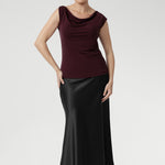 The Jordan Top provides comfortable coverage and structure. Proudly designed and made in Australia, this top combines timeless style with premium craftsmanship. Size 10 model wears her Jordan Reversible Top with black satin skirt.