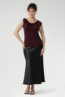 The Jordan Top provides comfortable coverage and structure. Proudly designed and made in Australia, this top combines timeless style with premium craftsmanship. Size 10 model wears her Jordan Reversible Top with black satin skirt.