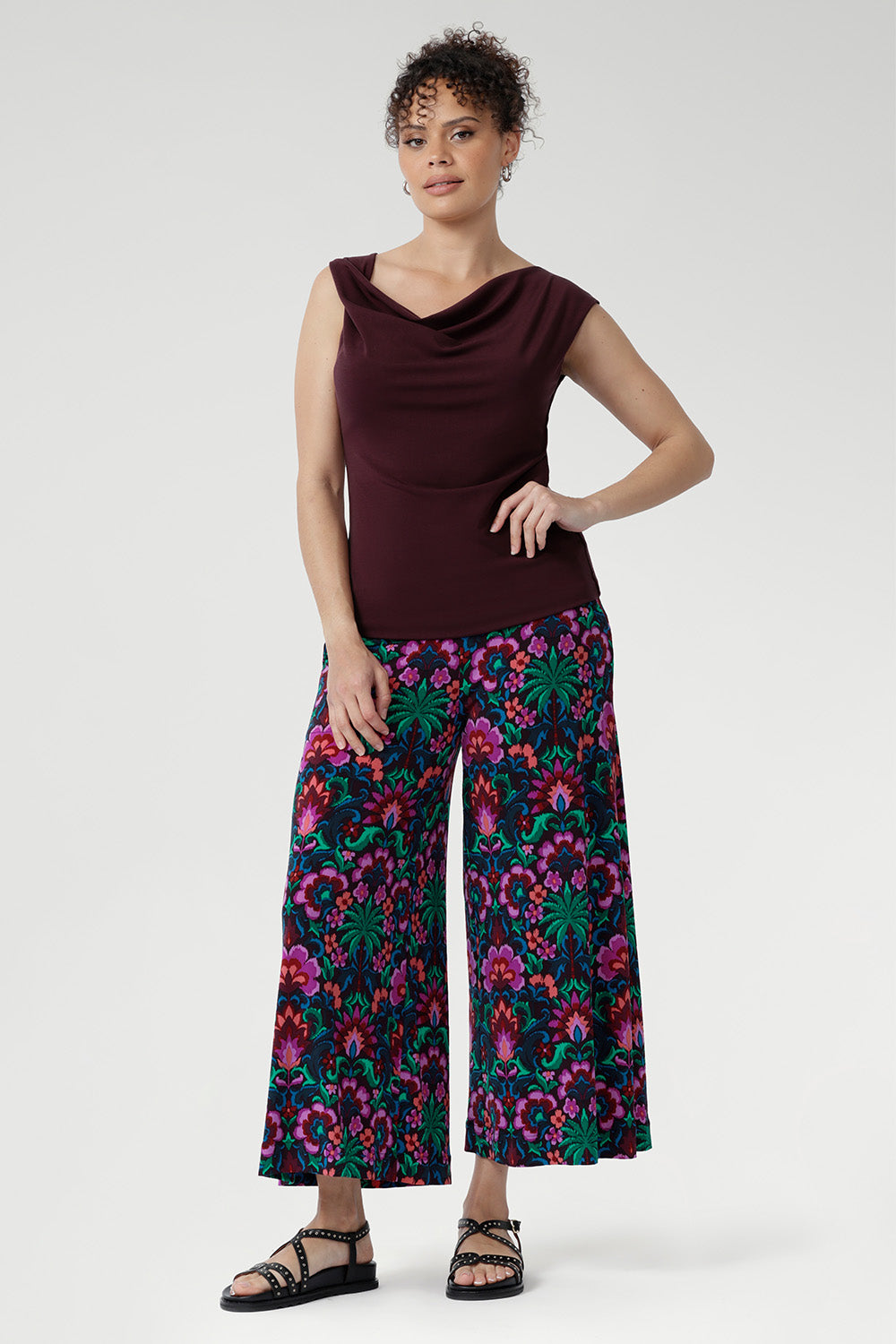 The Jordan Top ensures both comfort and structure. Proudly designed and made in Australia, it embodies high-quality craftsmanship and timeless versatility. Size 10 model wears her reversible top with printed culottes and chunky black sandals.