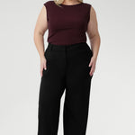 The Jordan Top in Wine is crafted from a luxurious heavy-weight Lyocell knit fabric that offers a silky hand-feel and a sophisticated, polished look. Designed to be reversible, this versatile top lets you choose between two elegant styles: wear it with a draped cowl neckline and twisted shoulder detail for a striking asymmetrical effect, or turn it around to reveal a refined boat-neck silhouette with gentle cowl draping at the back.