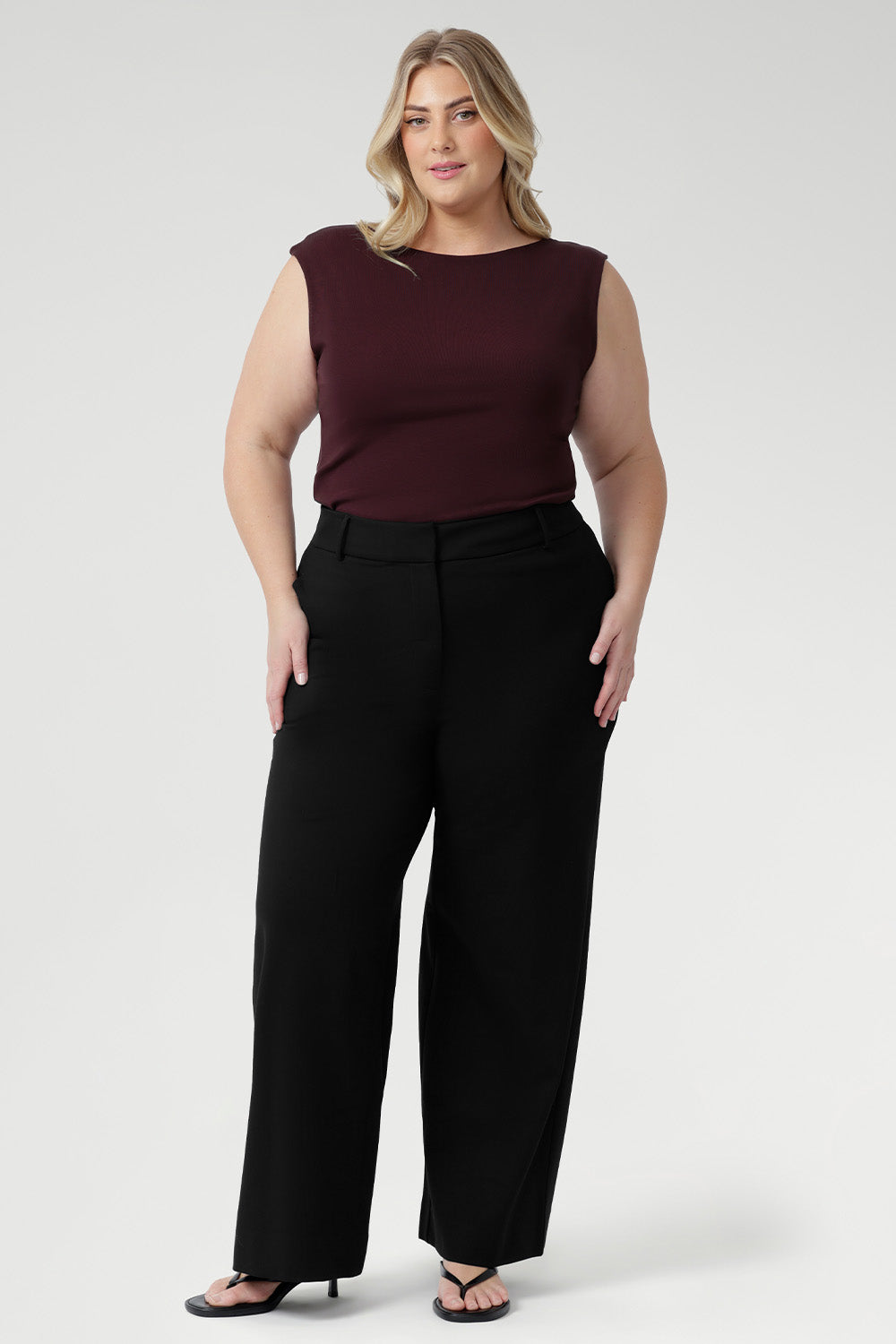 The Jordan Top in Wine is crafted from a luxurious heavy-weight Lyocell knit fabric that offers a silky hand-feel and a sophisticated, polished look. Designed to be reversible, this versatile top lets you choose between two elegant styles: wear it with a draped cowl neckline and twisted shoulder detail for a striking asymmetrical effect, or turn it around to reveal a refined boat-neck silhouette with gentle cowl draping at the back.