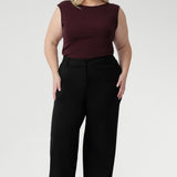 The Jordan Top in Wine is crafted from a luxurious heavy-weight Lyocell knit fabric that offers a silky hand-feel and a sophisticated, polished look. Designed to be reversible, this versatile top lets you choose between two elegant styles: wear it with a draped cowl neckline and twisted shoulder detail for a striking asymmetrical effect, or turn it around to reveal a refined boat-neck silhouette with gentle cowl draping at the back.