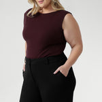 This reversible piece allows you to switch effortlessly between two distinct looks: wear it with the asymmetrical cowl neckline featuring a twisted shoulder detail for a sophisticated drape, or reverse it to showcase a chic boat-neck style with soft cowl draping at the back.