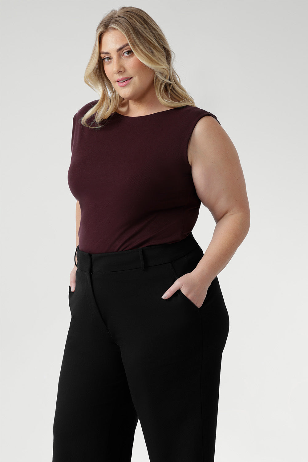 This reversible piece allows you to switch effortlessly between two distinct looks: wear it with the asymmetrical cowl neckline featuring a twisted shoulder detail for a sophisticated drape, or reverse it to showcase a chic boat-neck style with soft cowl draping at the back.