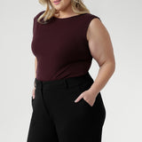 This reversible piece allows you to switch effortlessly between two distinct looks: wear it with the asymmetrical cowl neckline featuring a twisted shoulder detail for a sophisticated drape, or reverse it to showcase a chic boat-neck style with soft cowl draping at the back.