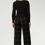 The Kade Pant forms part of the Cocoa Plaid collection—a sophisticated check in rich navy and graphite tones. A wide-leg cut that flatters and elongates. A tailored waistband with a fly front and hook-and-bar closure offers a smooth, secure fit, while belt loops, back darts, and side front pockets add classic suiting details with a modern edge.