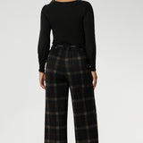The Kade Pant forms part of the Cocoa Plaid collection—a sophisticated check in rich navy and graphite tones. A wide-leg cut that flatters and elongates. A tailored waistband with a fly front and hook-and-bar closure offers a smooth, secure fit, while belt loops, back darts, and side front pockets add classic suiting details with a modern edge.