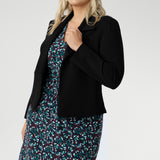 What sets Kadence apart is its versatility—this is a dress made for layering. Pair it with a tailored blazer for a polished workday look, or layer it under a trench or longline knit on cooler days. Its simple pull-on design and easy-care fabric make it an ideal piece for travel, busy mornings, or anytime dressing well needs to be uncomplicated.