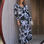 The Kimberley Dress is a timeless staple in women’s workwear Australia, crafted from dry-touch stretch jersey for all-day comfort. This elegant wrap dress features a flattering V-neckline, long sleeves, and a maxi silhouette—perfect for office wear and special occasions.
