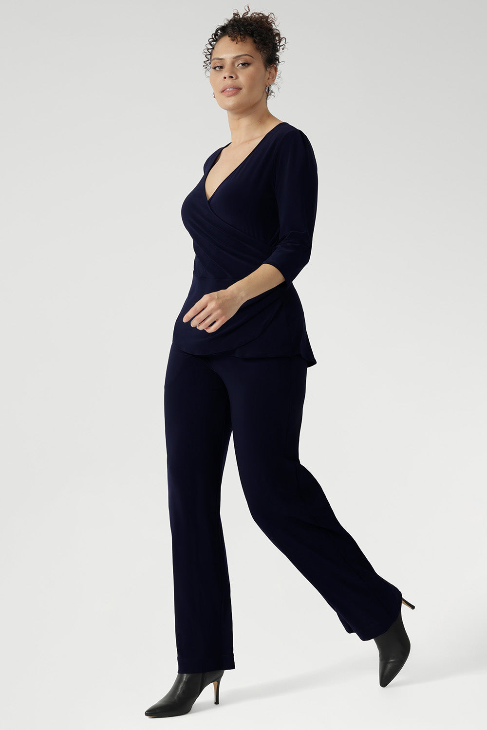 The Kyle Top is the perfect blend of professional polish and all-day comfort, making it a versatile addition to any modern wardrobe. Designed with a fixed wrap bodice that stays perfectly in place, this top offers the elegance of a wrap style without the need for constant adjustment. 