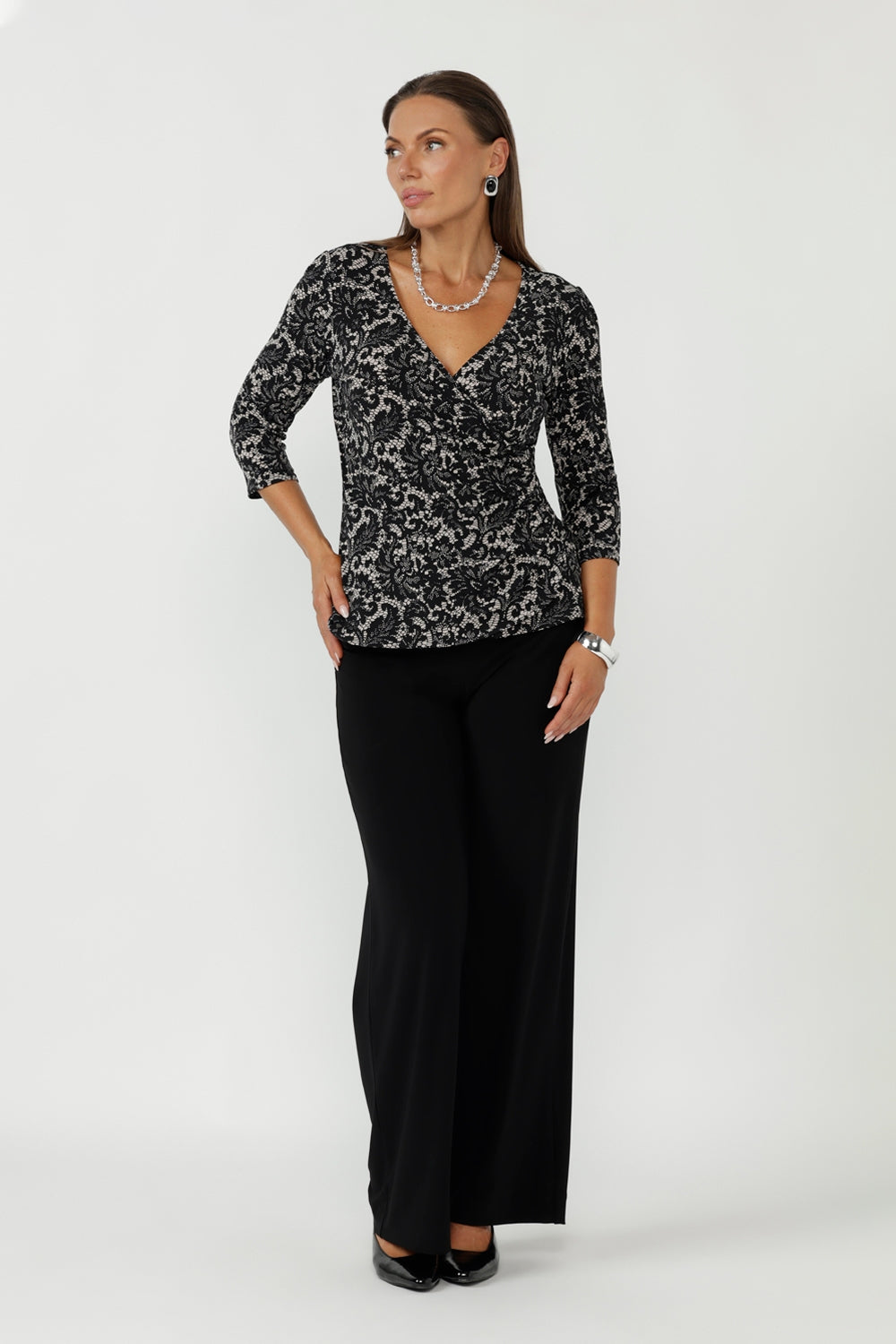 Featuring a flattering wrap bodice and soft peplum waist seam, the Kyle Top is perfect for polished workwear dressing.